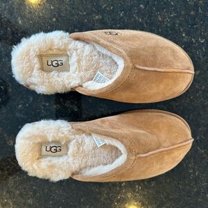 Brand new, never worn UGG slippers. Size 9 women’s.